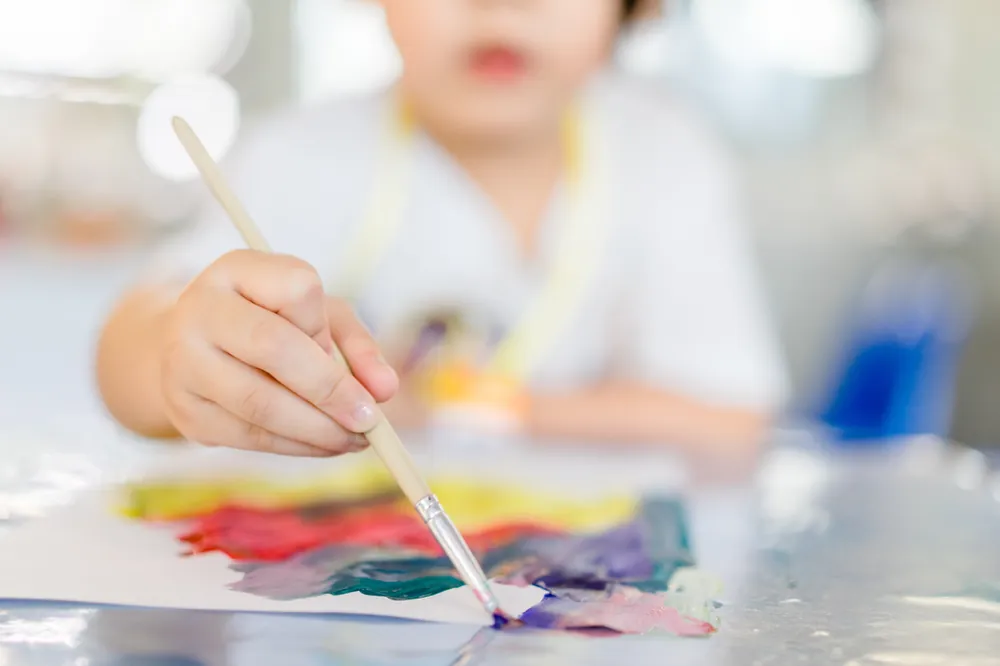 Child engaged in process art at Little Jungle Early Learning, Dundas