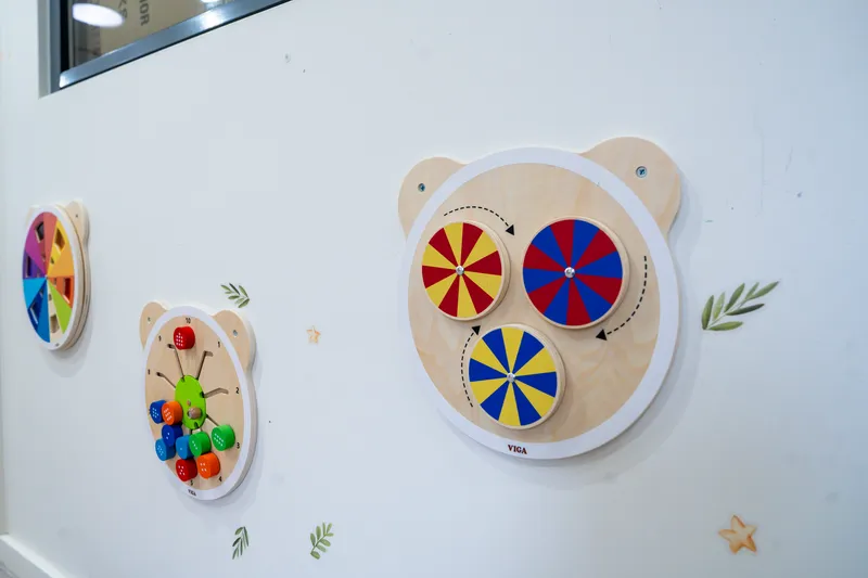 Wall-mounted wooden activity boards at Little Jungle Dundas