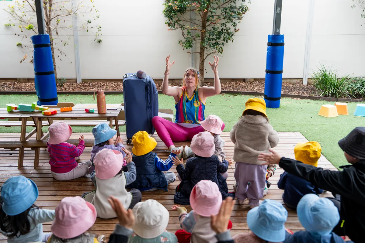 A visiting performer leading a session with children at Little Jungle Dundas